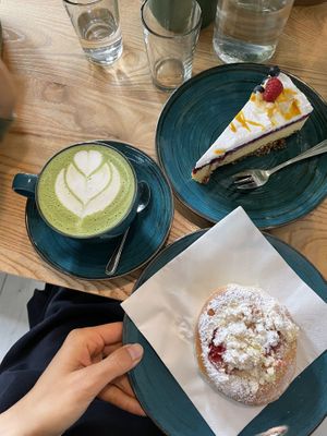 Matcha latte with pea milk, cheesecake and a bun  at Kawastrofa in Wroclaw