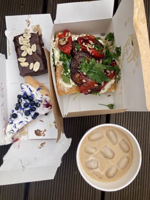 Best ever sneakers like cake with chokolate and soft caramel. Blueberry pie. Foccasia. Iced coffe with caramel syrup.   at Kawastrofa in Wroclaw