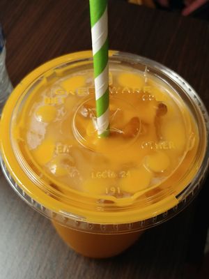 Thai Tea grenware and paper straw at Happiness Cafe in San Jose