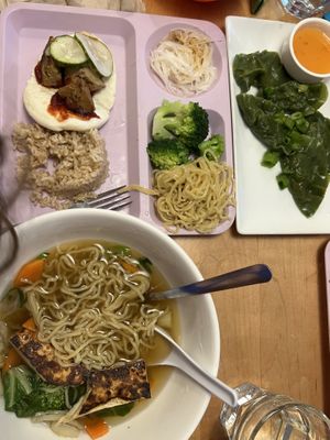 Kids’ bento box with seitan and a kids’ noodle bowl with tofu. Also pictured:  vegetable dumplings.  at Yum Yum Noodle Bar in Woodstock