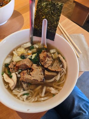 Vegan bowl with udon, vegetable broth, and seitan at Yum Yum Noodle Bar in Woodstock