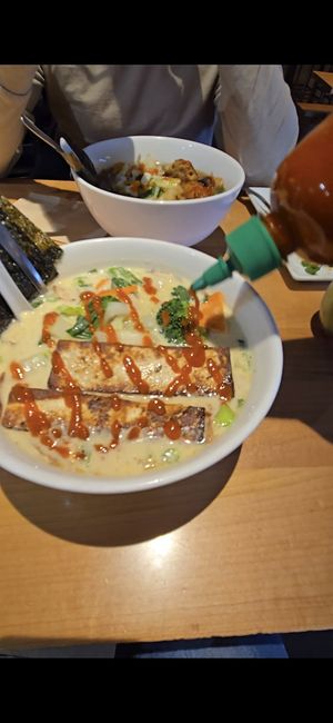 Vegan noodle bowl with coconut curry, udan noodles, tofu, extra veg at Yum Yum Noodle Bar in Woodstock