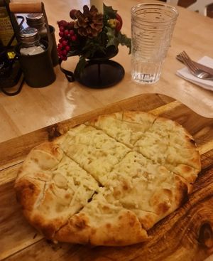 Garlic and Rosemary bread with vegan cheese at La Dolce Tavola in Rugby
