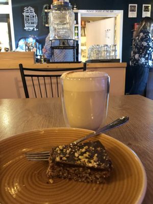Oat chai latte and vegan raw cake  at Café Huskies in Longyearbyen