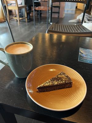 Vegan raw cake and oat milk latte  at Café Huskies in Longyearbyen