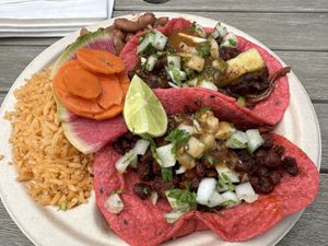 Alpastor taco, chorizo taco, beans & rice  at Rico Rico Vegano in Oakland