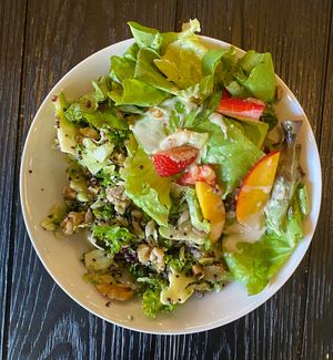 Two absolutely delicious salads on one plate. 1) kale and broccoli 2) unsure of name — contained fruits, nuts and greens and was finished with a tahini dressing. at Simply Son Braho in Mallorca