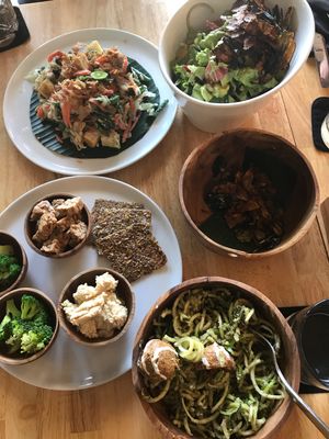 Gado Gado, salad bowl, kale chips, zucchini noodles/ falafel/ pesto dressing, smoked tempeh, crackers, hummus and broccoli...  at Living Food Lab Canggu in Canggu