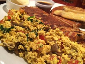 Combo plate: Pancake, tofu scramble with veggies, and house potatoes. Tasty.  at Herbivore - Divisadero in San Francisco