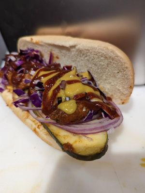 BBQ PORK: Pickles, red onions, red cabbage slaw, cheddar sauce at Frondescence in Boise