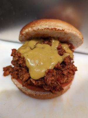 SLOPPY JOE: BBQ sauce, organic tomato, red onion, cheddar sauce  at Frondescence in Boise