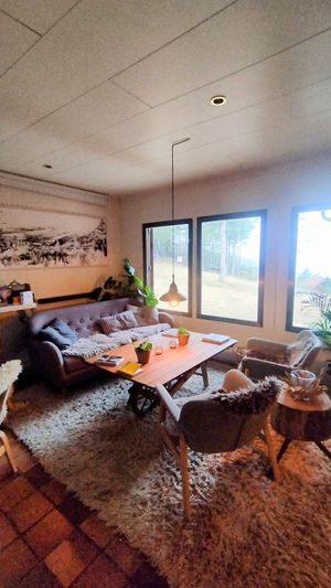 Main area with a bar at Minds & Mountains Eco Lodge in La Molina