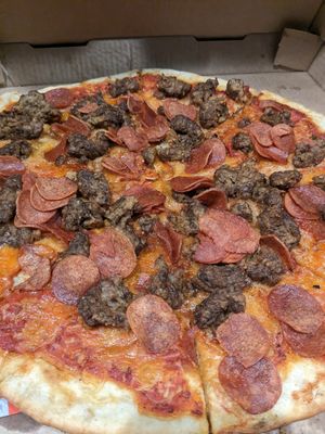 Sausage & pepperoni pizza at Mora Pizza Denver in Denver