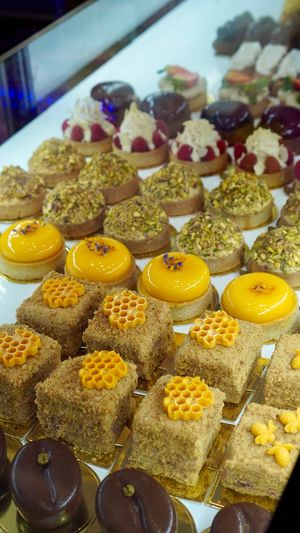 Display the second day I visited (honey cake, tangerine tart, pistachio tart, Raspberry&marzipan tart, cherry&chocolate tart, my favourite)  at Cream Dream in London