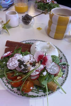 Avocado toast with bacon and poached egg.  at Cream Dream in London