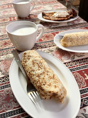 Collab with 2002 place, Daner pizza and Letters&Numbers (Feb 25, 2023): vegan crepes with seitan and sauerkraut and "cheese". Kimchi crepe at the backgroud + vegan latte. at Letters and Numbers in Yerevan