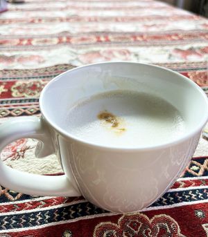 Vegan latte with almond milk, perfect taste. You can take your coffee out of the cafe and drink it at a table in the backyard, really cool! at Letters and Numbers in Yerevan