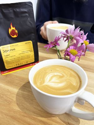 Perfect coffee with oat milk in cosy Letters&Numbers coworking. In the background is a package of coffee that I chose from a coworking coffee shop. The coffee was in beans, but they ground it for me there, it was so sweet! at Letters and Numbers in Yerevan