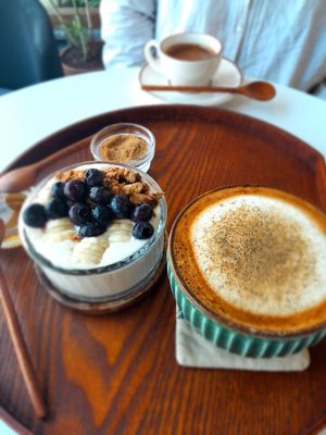 Lovely yoghurt bowl and vegan latte at Some of us Coffee - Maybe closed in Jeju