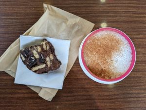 Traditional Greek chocolate-biscuit cake and cappuccino at Bamboo Vegan Cafe in Athens