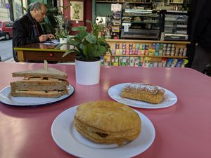 Tofu sandwich, ham and cheese pastry, vanilla custard pastry with cinnamon and sugar at Bamboo Vegan Cafe in Athens