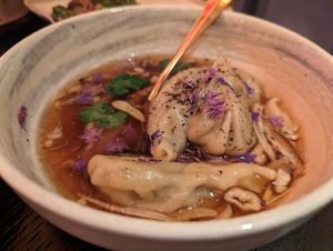 Spinach & mushroom gyoza, fragrant ginger dashi, black truffle at The Ivy Asia in Guildford