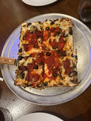 Vegan cheese. Artichoke hearts, black olives and mushrooms. Delicious!!!  at Toni's Pizza in Mount Pleasant