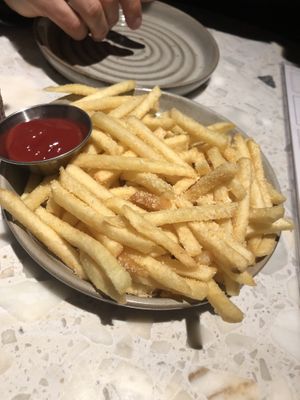 Planta burger -no lettuce, no tomato, no mustard, no queso, no pickle , no mayo, just onion (served with fries, not salad) 
  at PLANTA in Brooklyn