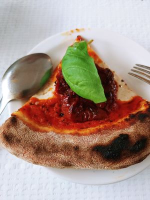 Pizza slice close-up at Ferments - 퍼멘츠 in Seoul