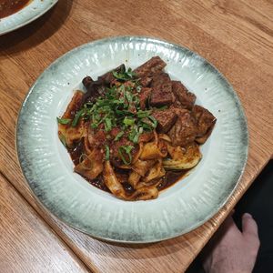 Vegan "spicy" (not) biang biang noodles with tofu at Noodle Fan in Cologne