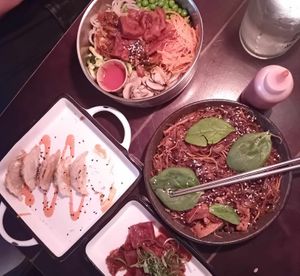 My dishes: bibimbap (top) and dumplings (left) at SSAM Korean Food Bar in Copenhagen