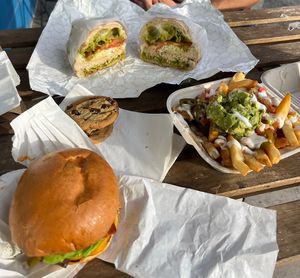 Caballero burger (junior), nacho fries, cookies, and meati chicken pesto sandwich  at Mission Burger Co in Austin