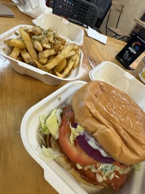 The buffalo chicken burger and garlic fries. Yummmmmm!   at Mission Burger Co in Austin