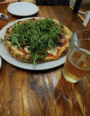 Vegan pizza with arugula. mushrooms and a vegan cashew cheese.  at Via Tevere Pizzeria Napoletana in Vancouver