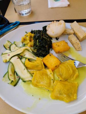 Ravioli, caponata di zucchine, soy curls, cicoria (dandelion greens), polenta, tempura, cheese at Ops Cucina Mediterranea in Rome