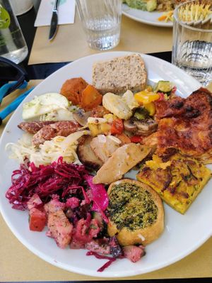 Lasagna, croquette, cabbage salad, beet salad, meatballs, veal roll, burger, cheese at Ops Cucina Mediterranea in Rome