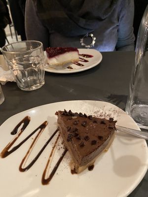 Vegan cheesecake and dark chocolate cake at Ops Cucina Mediterranea in Rome