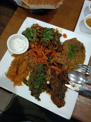 Vegan flight - I had the basmati saffron rice in the side. The butternut squash was sweet and absolutely great with the hot sauce from the dips! at Afghan Bistro in Springfield