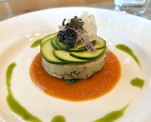 White fish-style soufflé made with soy milk. Served with tomato and basil sauces. Tapioca caviar atop.   at Pas a Pas in Miyota