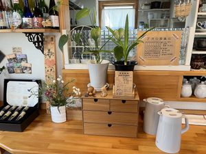 In front of kitchen   at Pas a Pas in Miyota