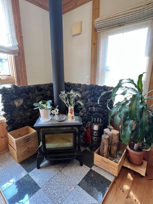 Wood fireplace in Dining area   at Pas a Pas in Miyota