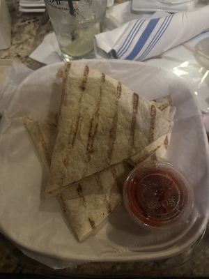 Quesadilla with sliced potatoes and green onions inside and a side of salsa  at Bartlet Street in Andover