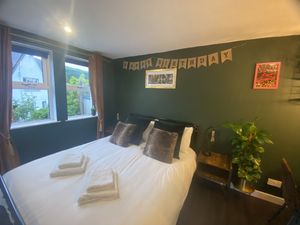 Double bedroom with some thoughtful decoration!  at Greenstone Lodge  in Bridge Of Orchy