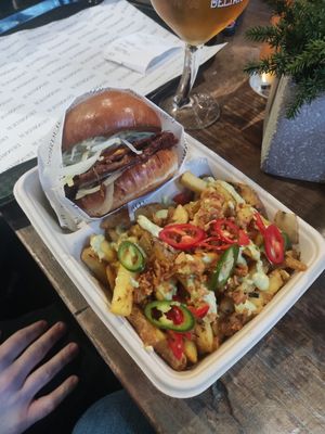 Smash burger with bacon and salt and pepper fries at Disorder  in Manchester