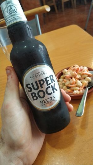 Cerveza portuguesa con tapa at Puzzle Bar in Gijon