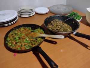 Left pan: Stir fried veggies and green beans. Right pan: Sautéed mushrooms in soy sauce. at De Otter in Leiden