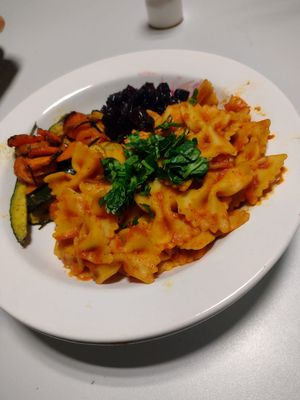 Pasta with sweet and spicy tomato sauce along side roasted root vegetables  at De Otter in Leiden