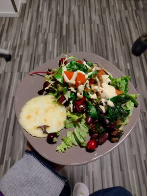 Freshly baked arepa, served with a delicious dressing and tahini dressing  at De Otter in Leiden