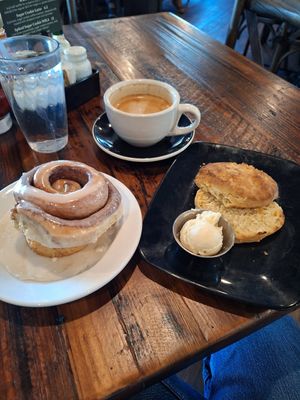 Cinnamon roll, cheesy vegan biscuits with butter, oatmilk latte at Seven Mile Cafe in Mesquite