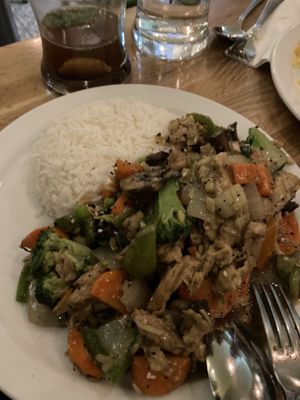 Ginger sauce plant-based chicken and vegetables stir fry  at Tula in Montreal